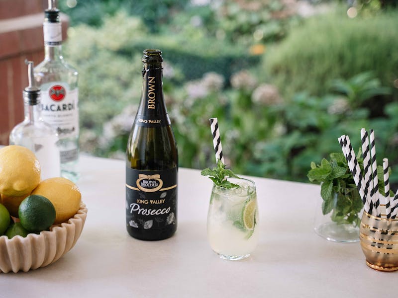ingredients for a prosecco cocktail with bottle of prosecco nv