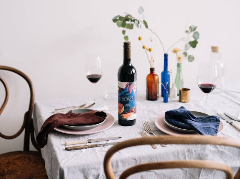 Bottle of Brown Brothers Blaze Aid Shiraz on table