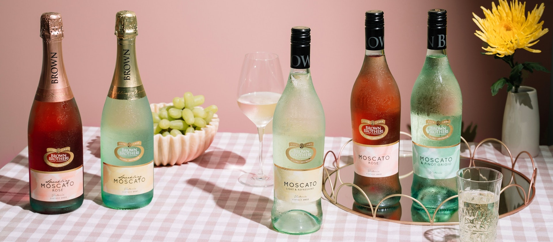 range of Brown Brothers Moscato on a checkered pink tablecloth