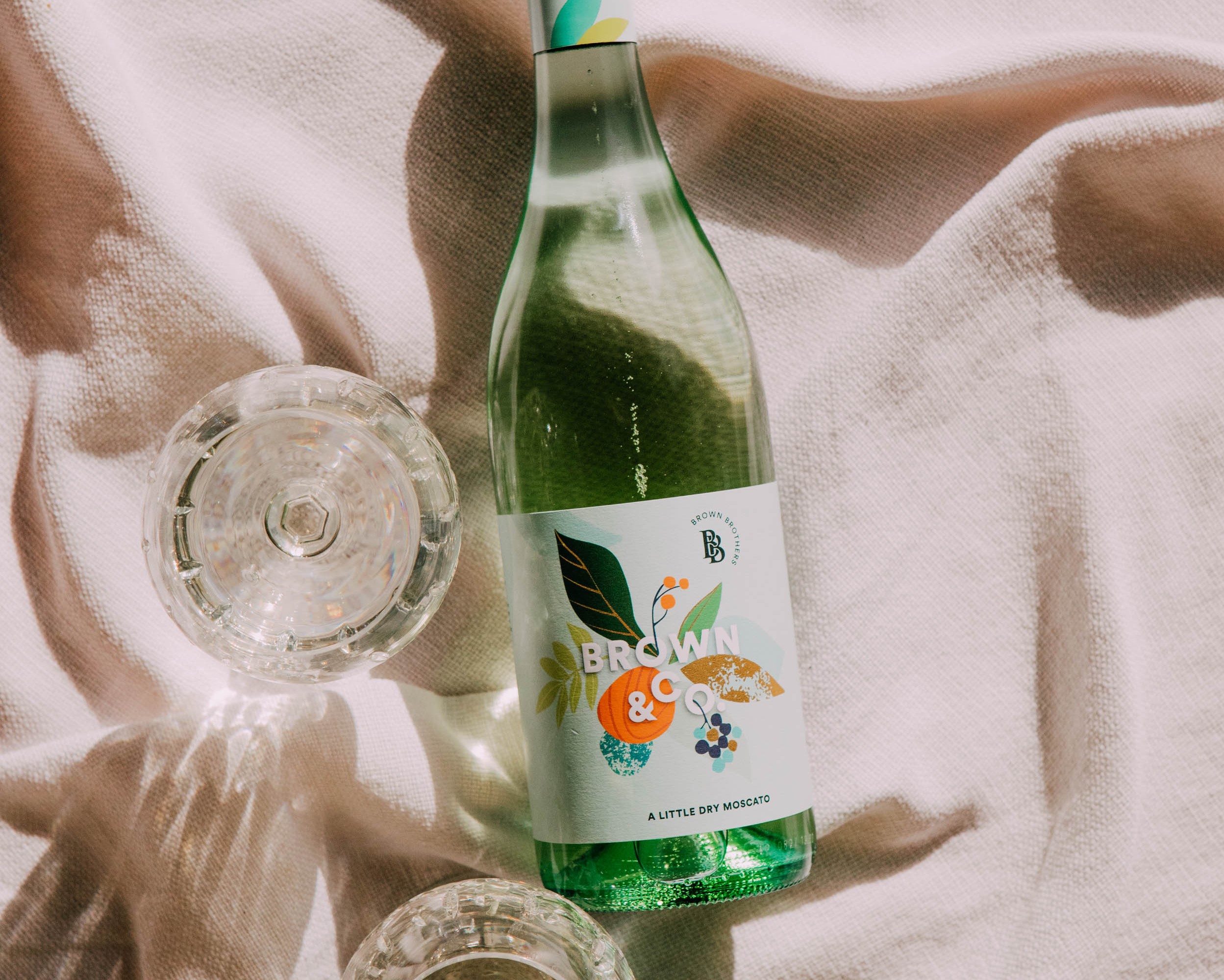 bottle of brown & co moscato laying flat