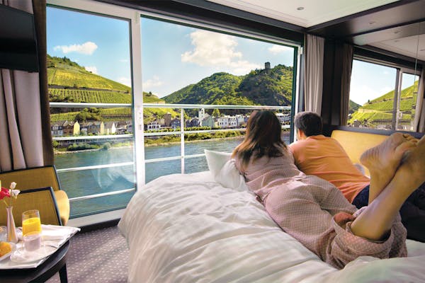 Couple on bed in room on cruise