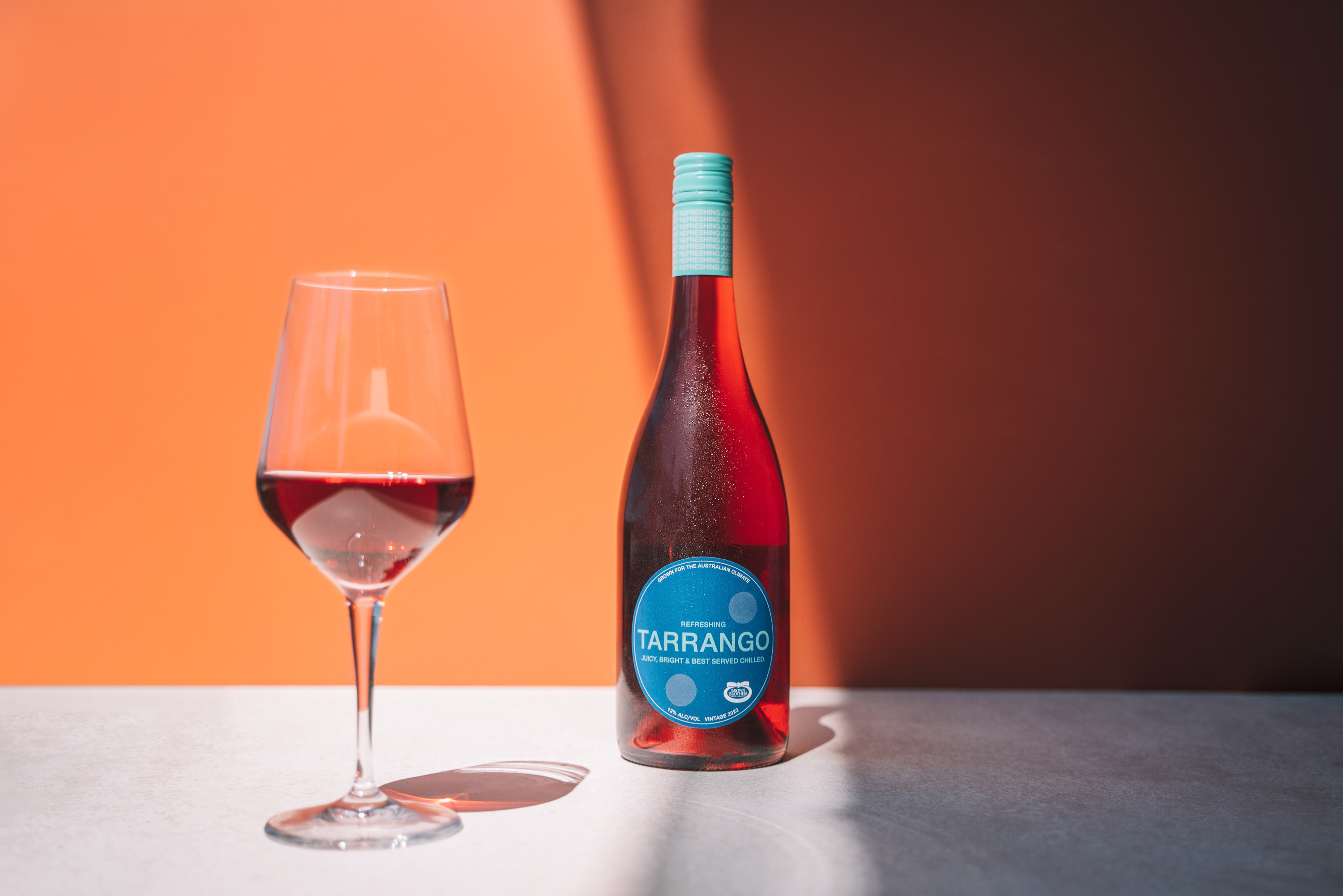 Bottle of Tarrango next to glass of red wine