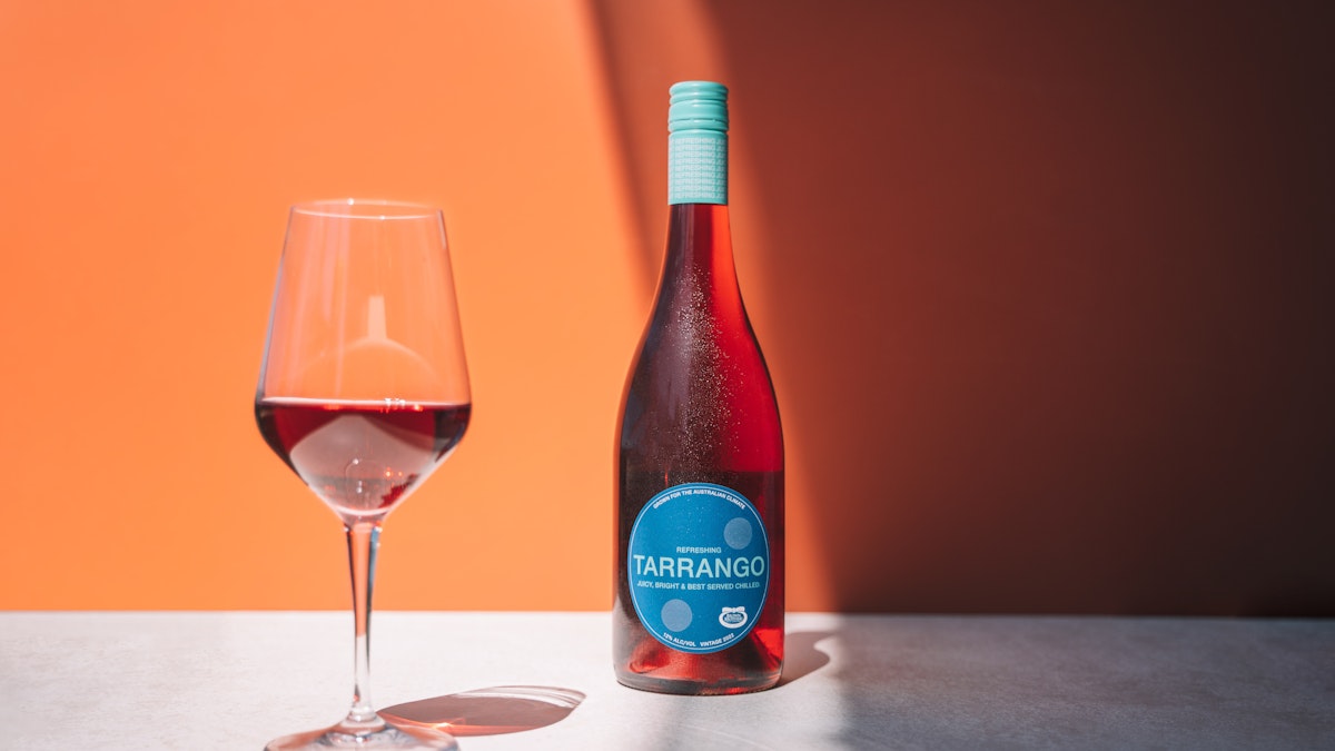 Bottle of Tarrango next to glass of red wine