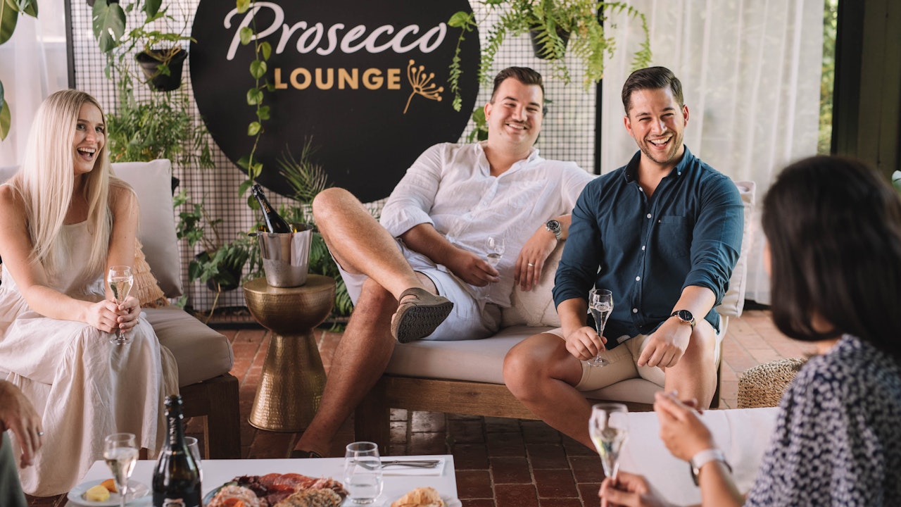 Friends enjoying the Prosecco Lounge