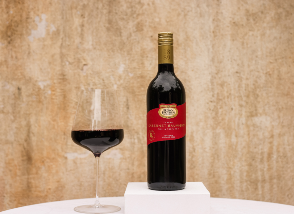 A bottle of Brown Brothers Cabernet Sauvignon with a glass of wine