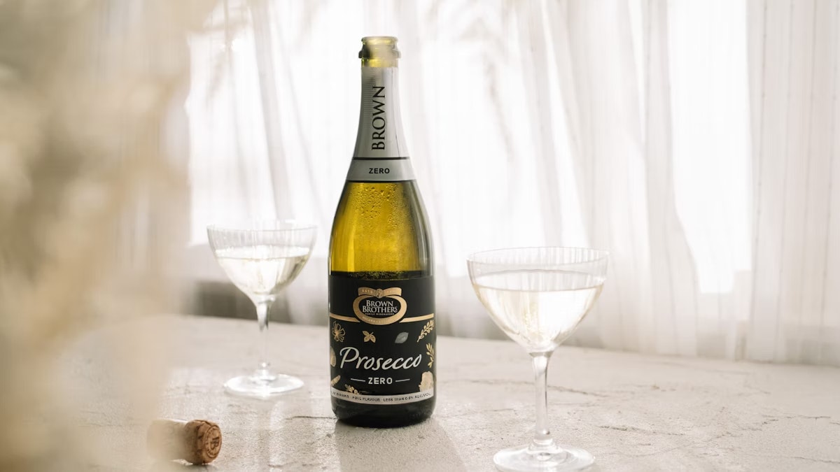 Bottle of Brown Brothers Prosecco Zero with two glasses