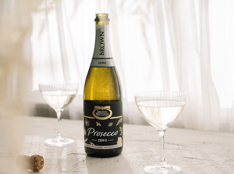 Bottle of Brown Brothers Prosecco Zero with two glasses