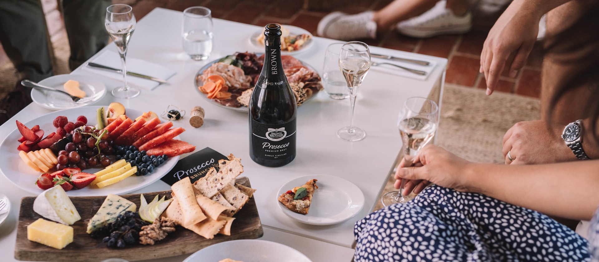 Food and wine layed out on table for Prosecco Brunch