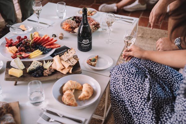 Food and wine layed out on table for Prosecco Brunch