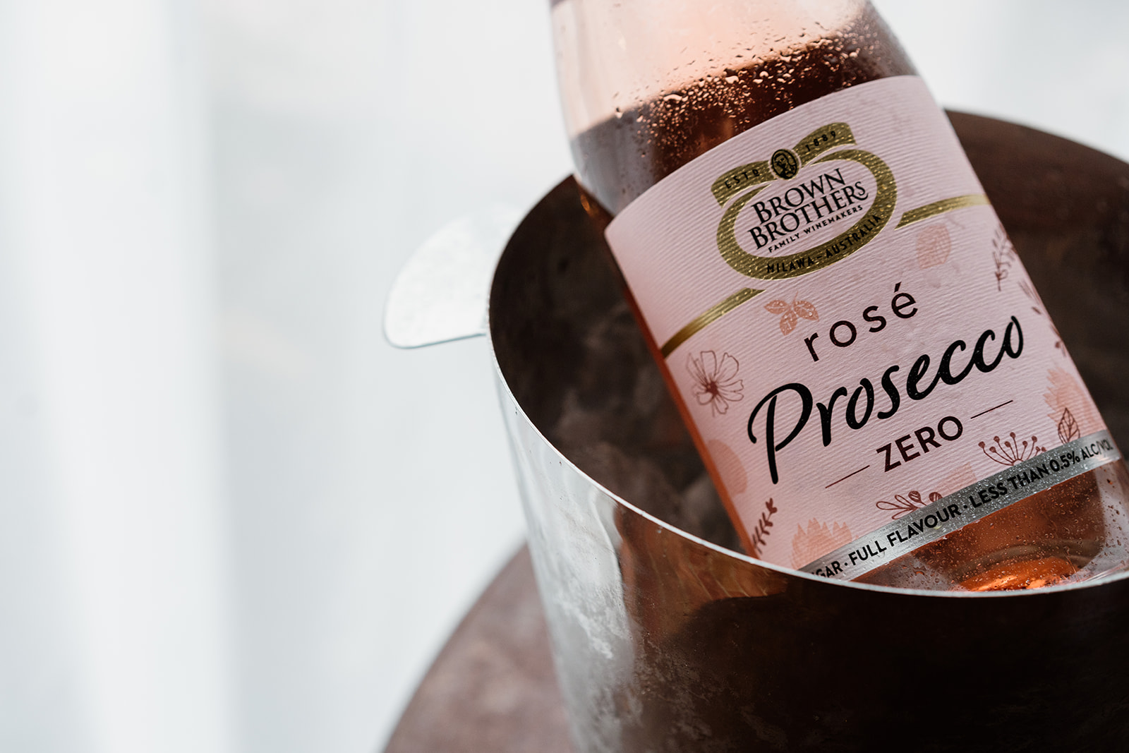 closeup bottle of prosecco zero NV in an ice bucket