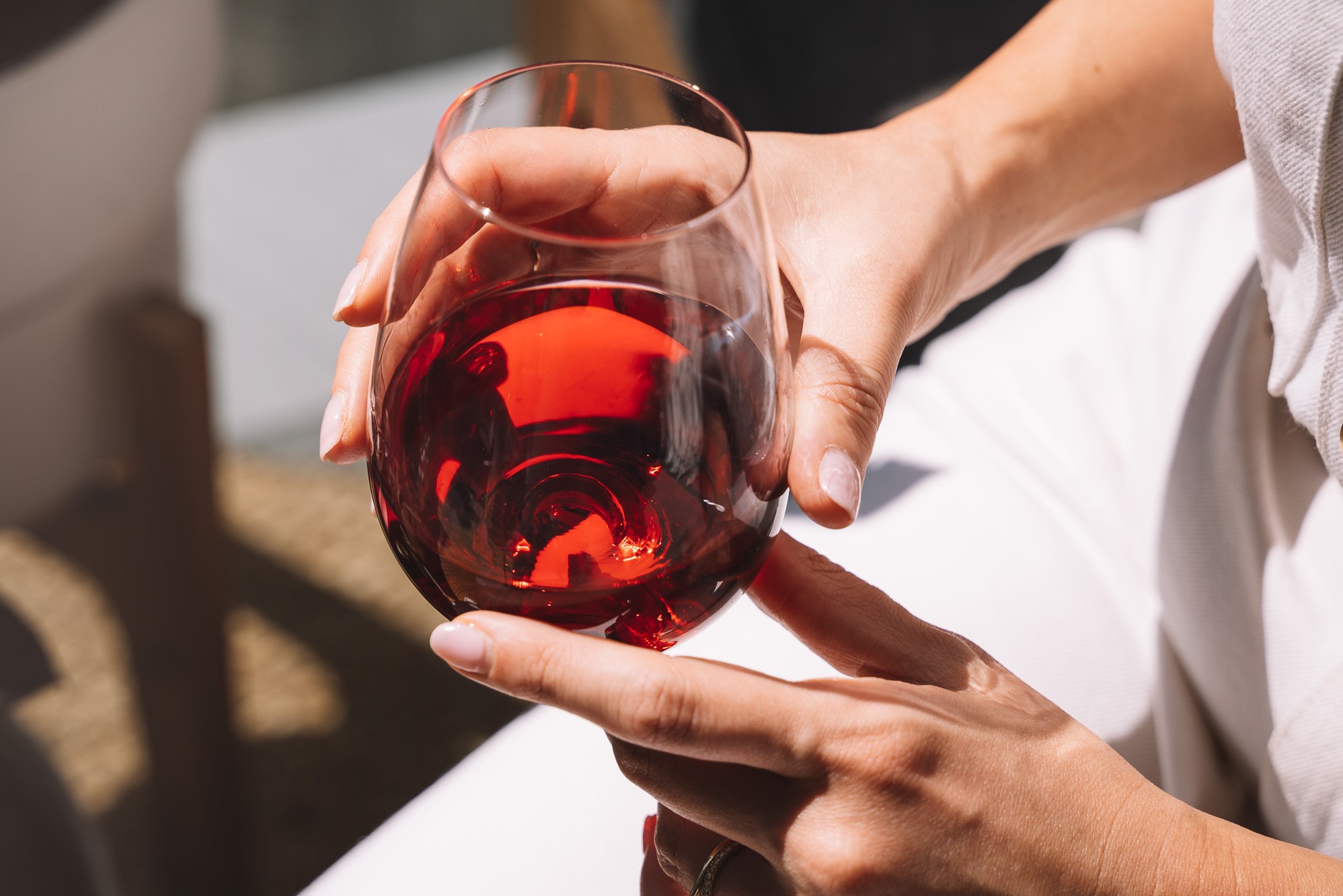 closeup of red wine in stemless glass