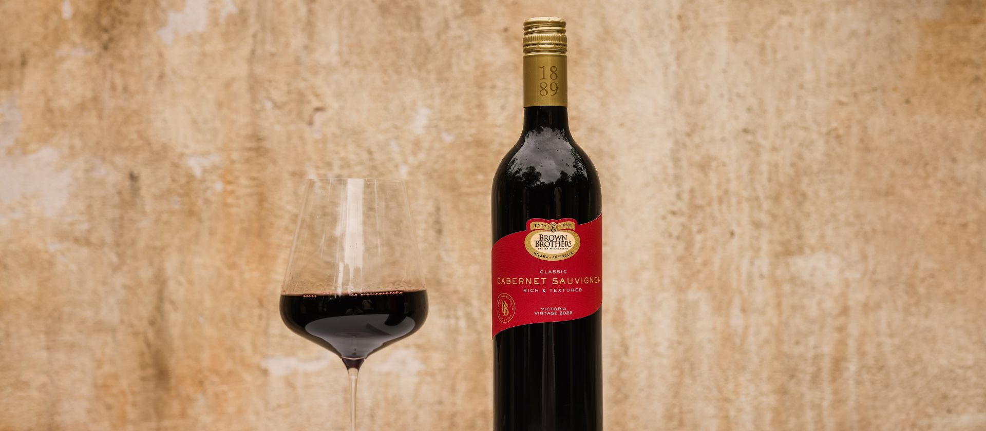 A bottle of Brown Brothers Cabernet Sauvignon with a glass of wine