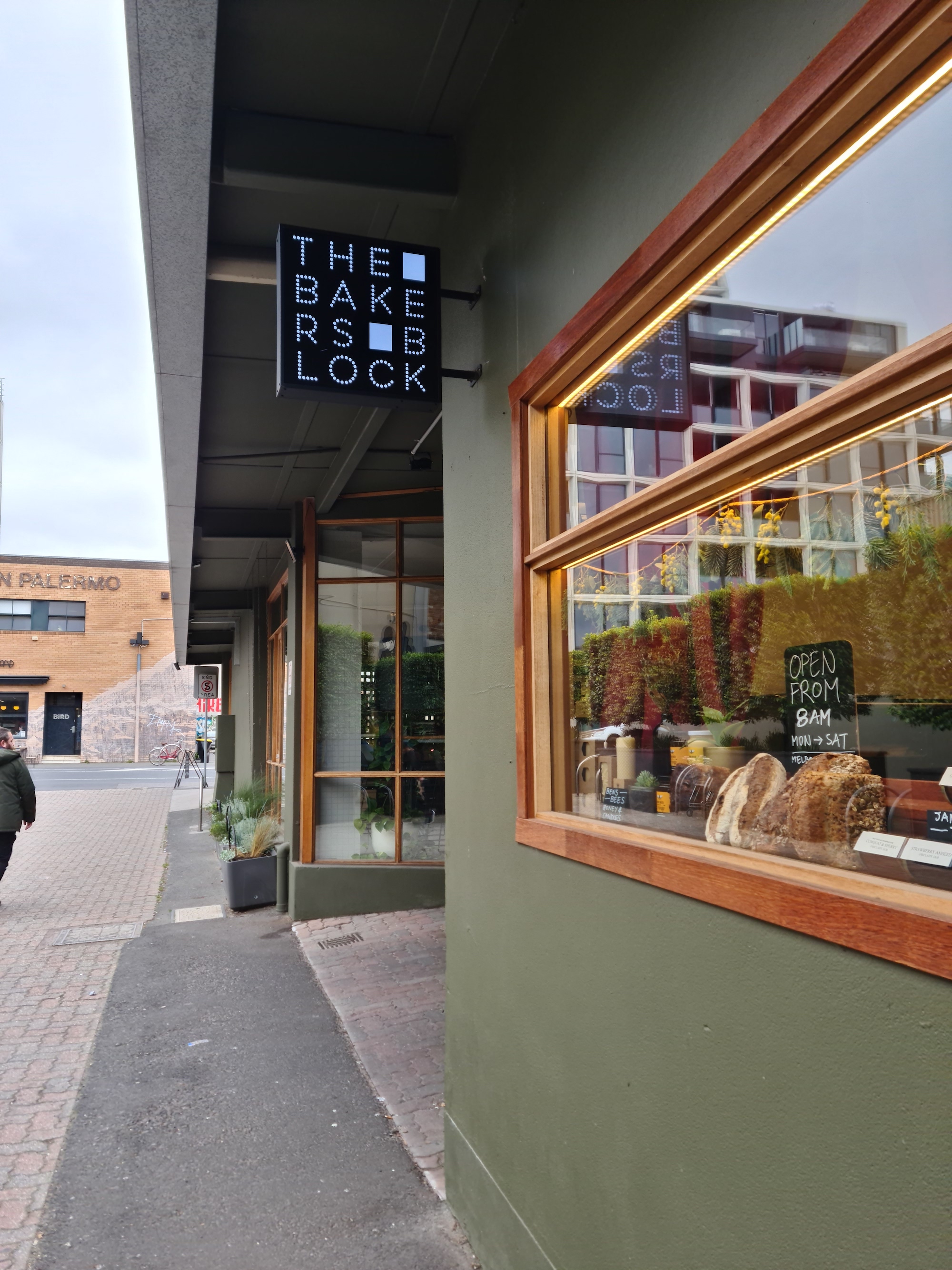 A black and white square sign that read the bakers block over multiple lines.