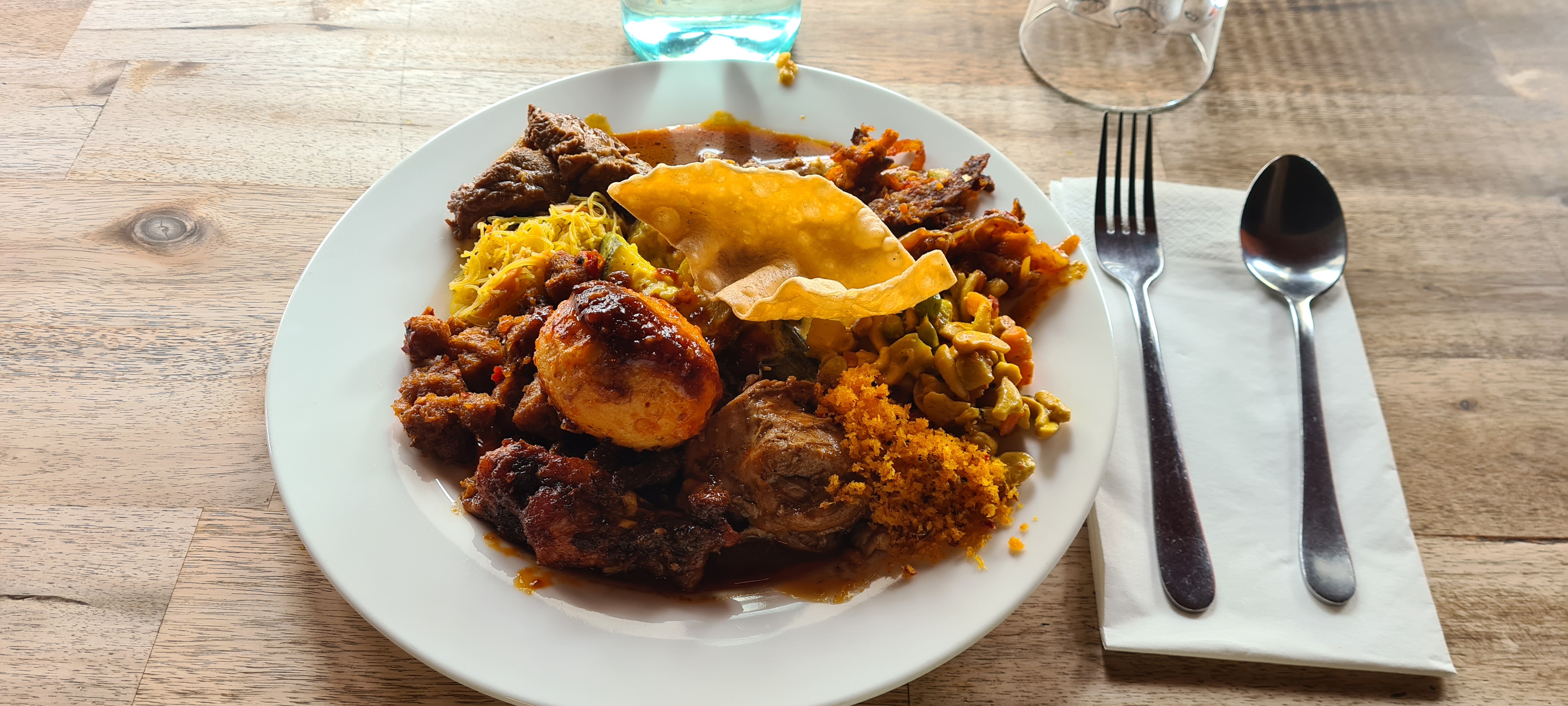 A plate of homestyle Sri Lankan food pile high