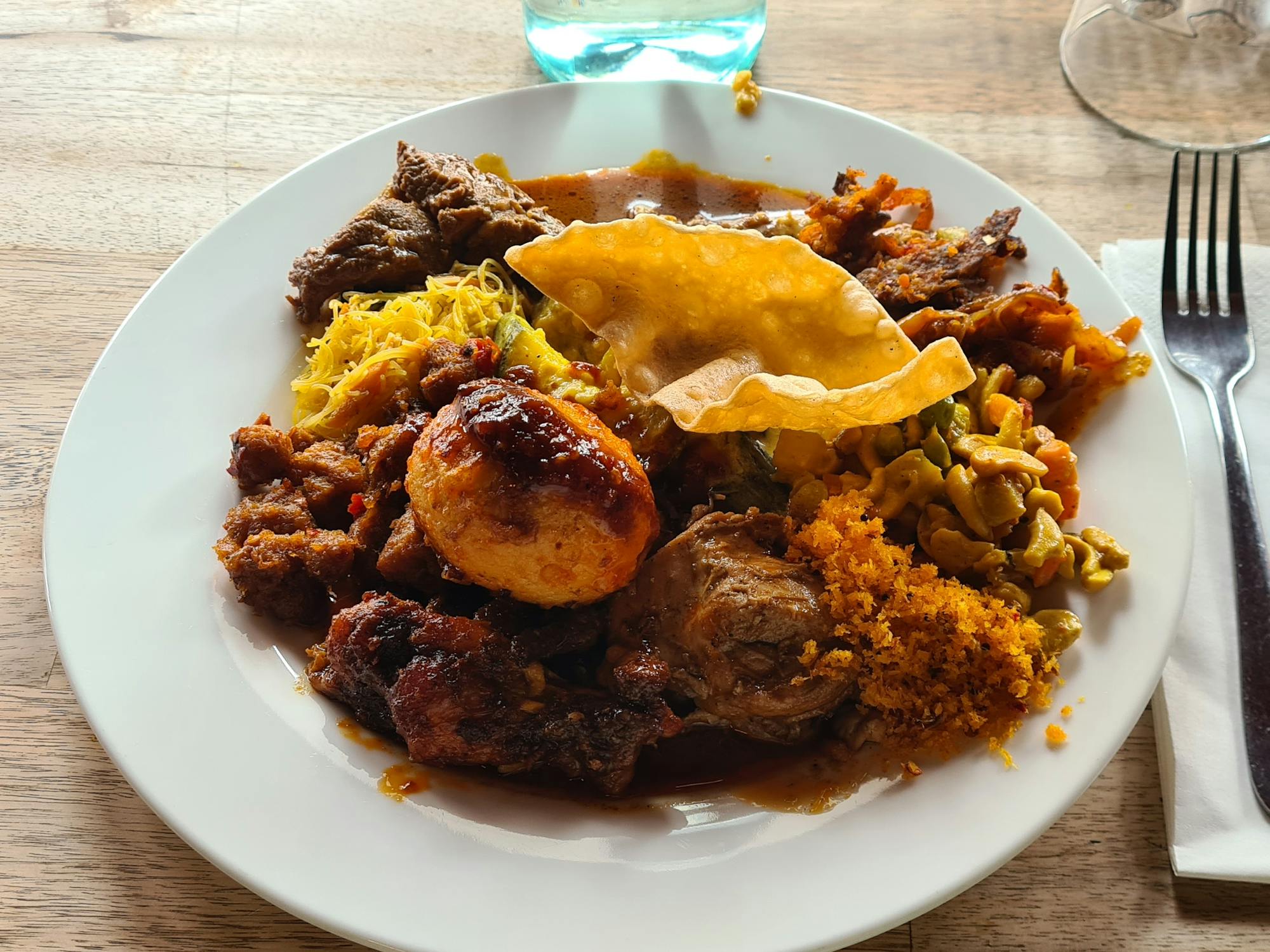 A plate of homestyle Sri Lankan food pile high