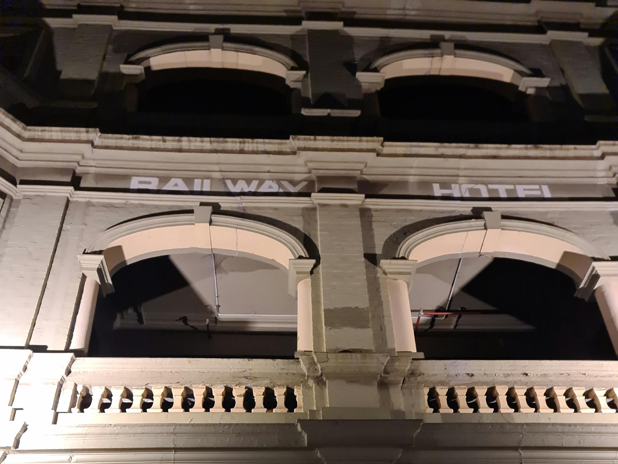 A Georgian style facade with arches and balconies