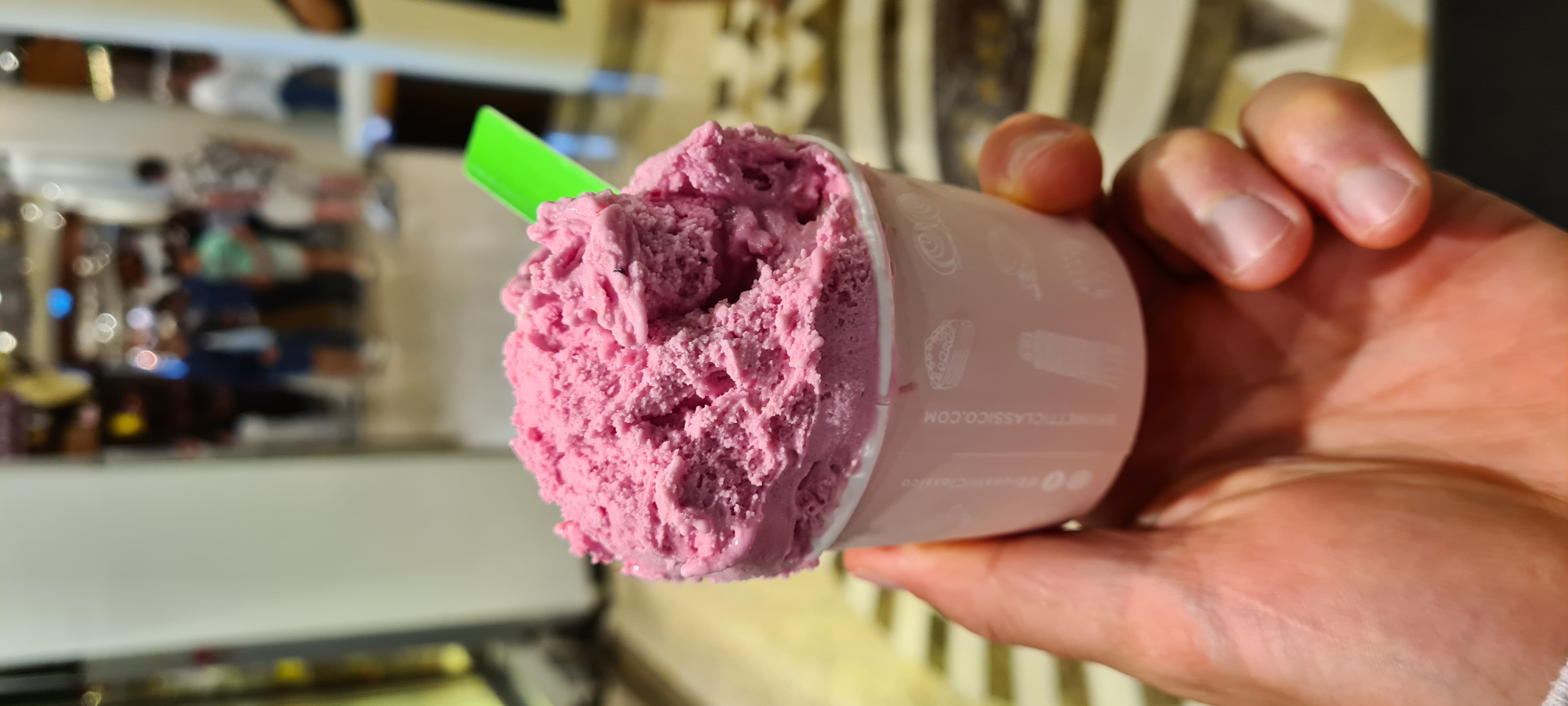 Vibrant deep pink ice cream in a cup