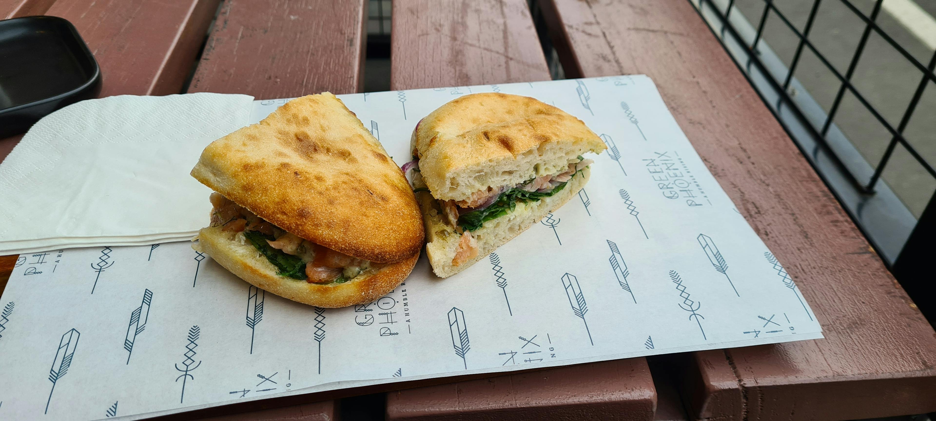 Salmon sandwich on an exterior table