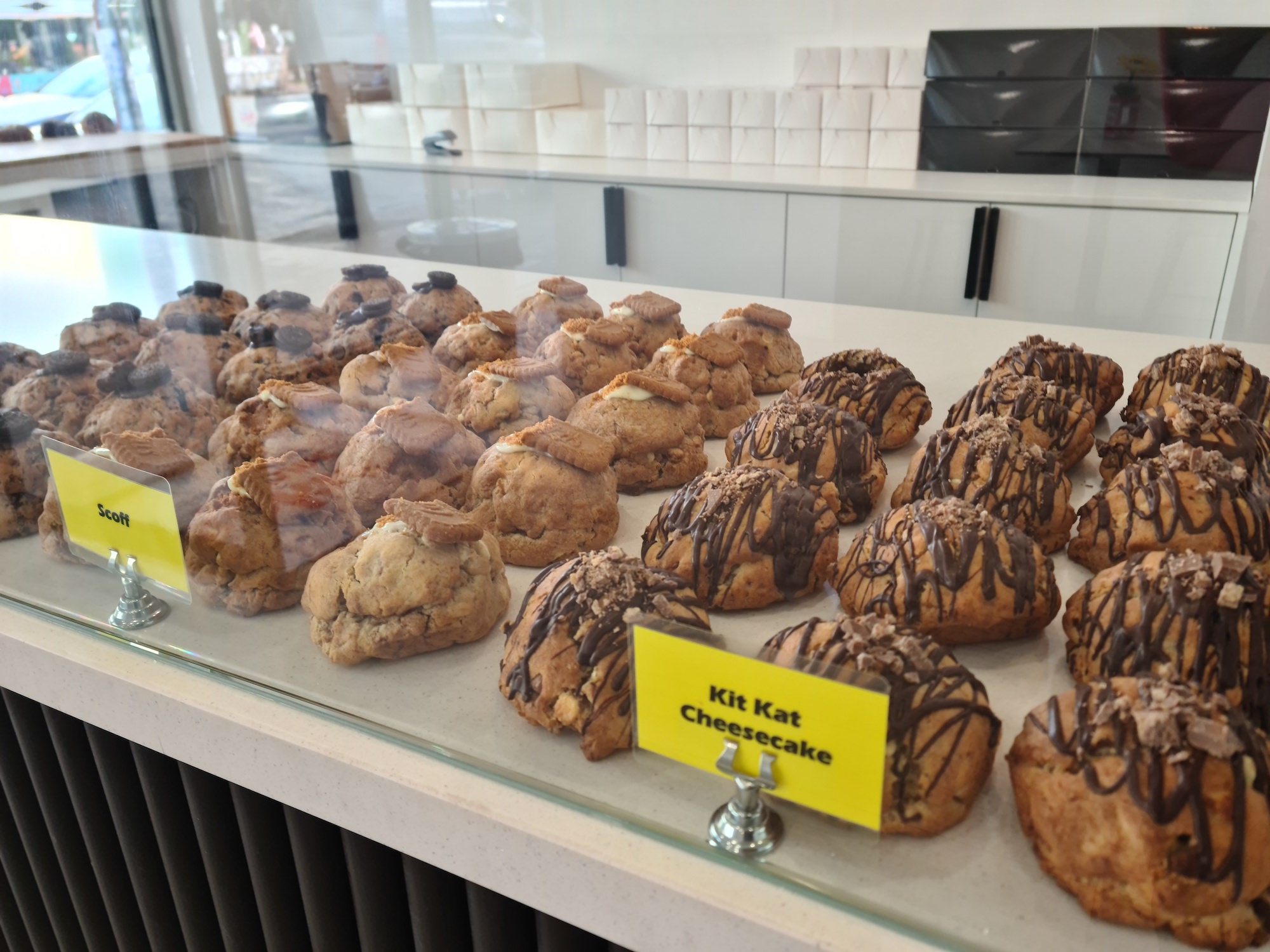 Lines of thick, chunky cookies with different toppings. 