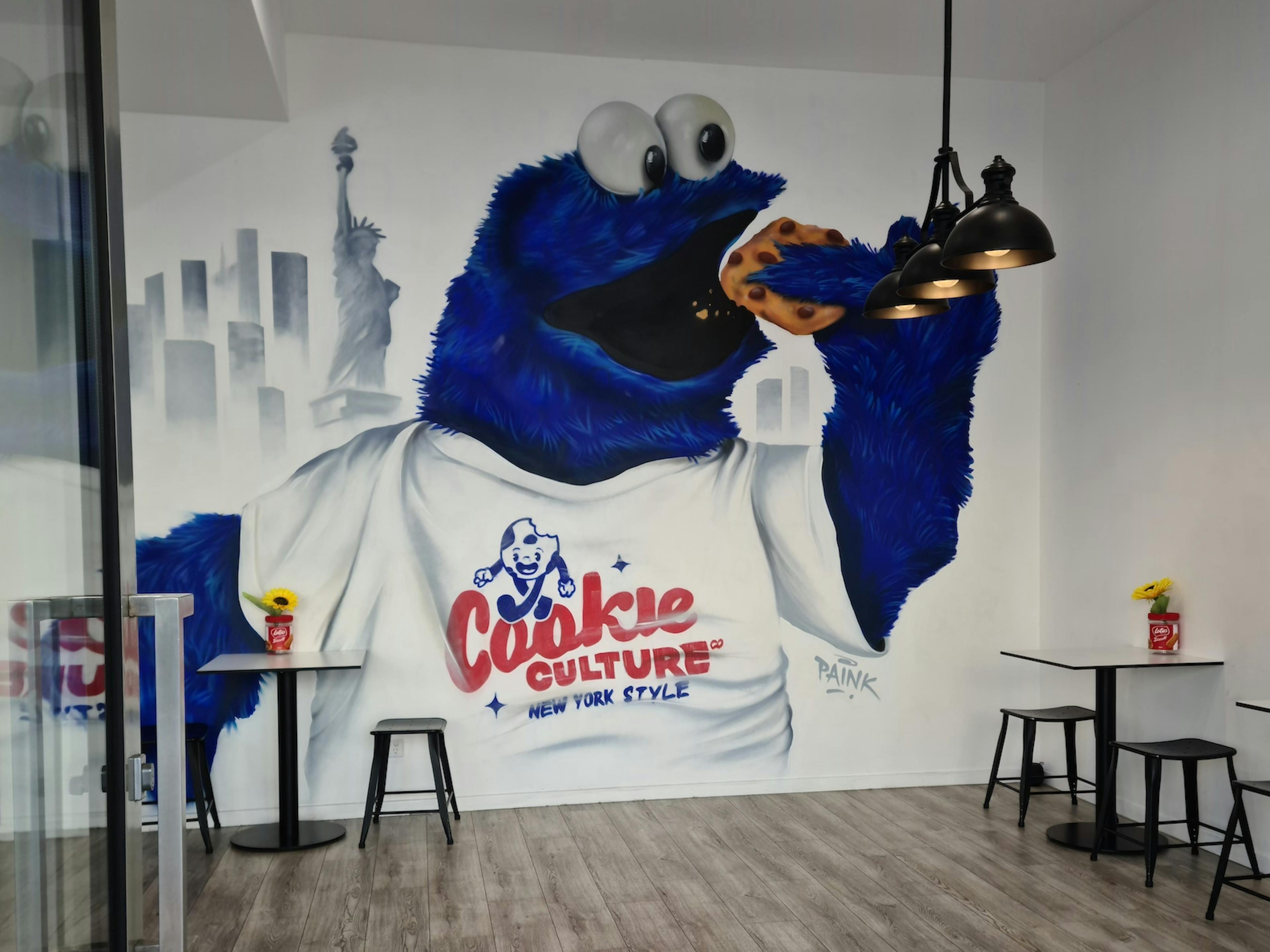 Mural of cookie monster wearing a Cookie Culture shirt