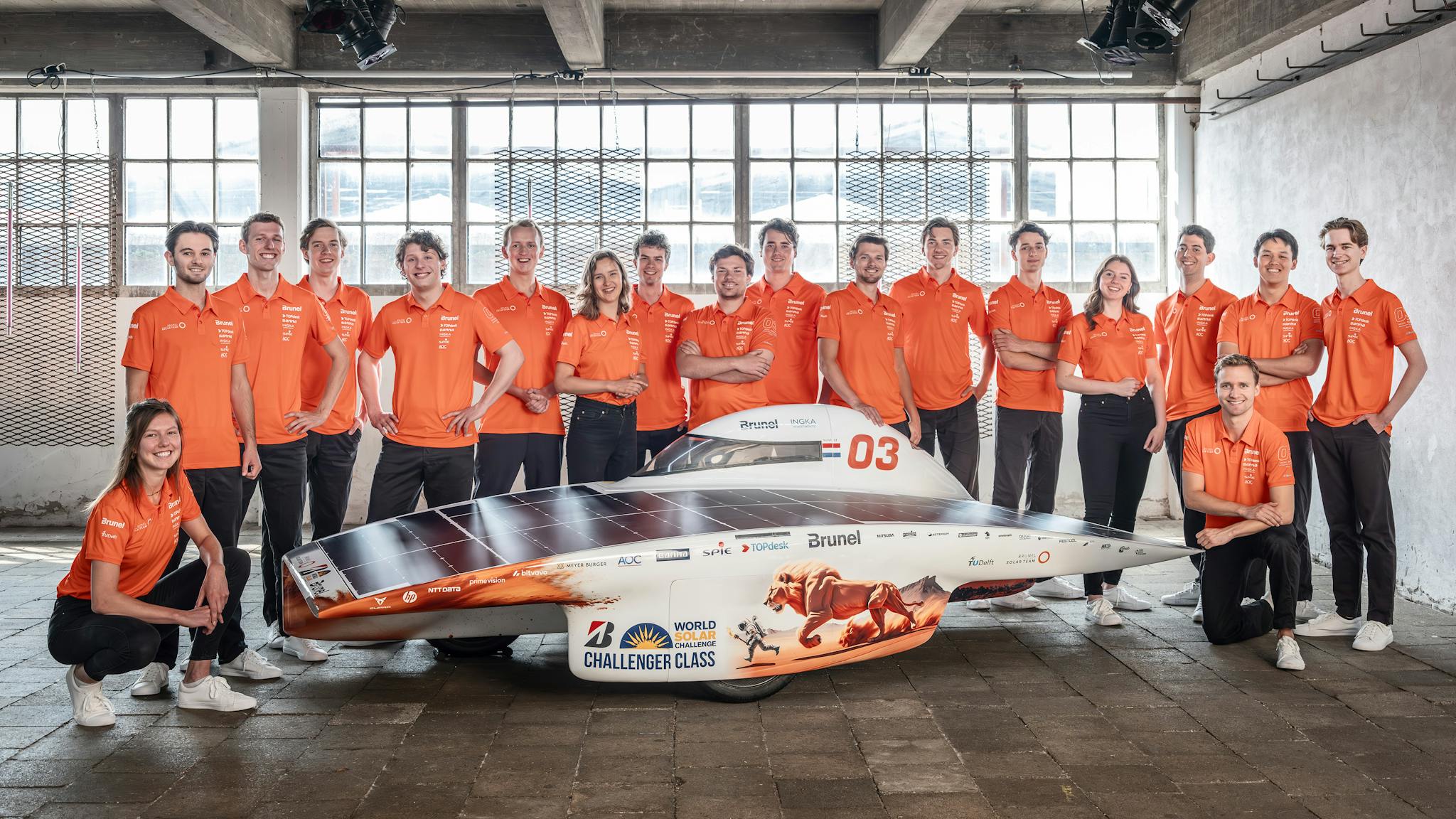 Nuna 12 solar car with teammembers