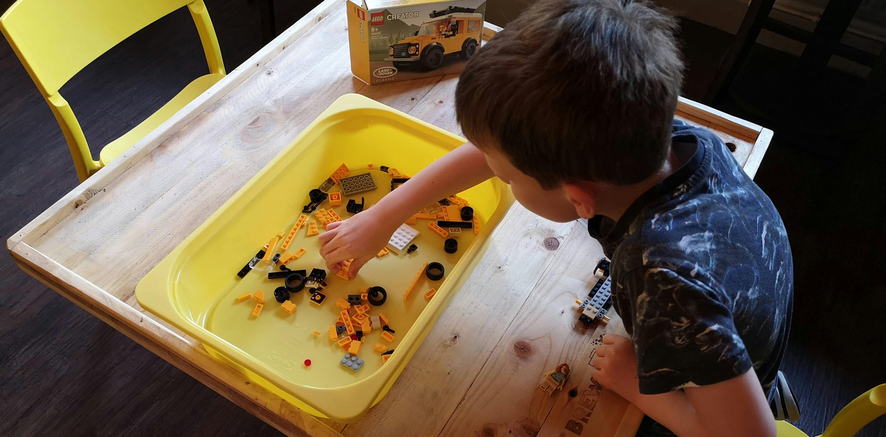 Child playing with LEGO