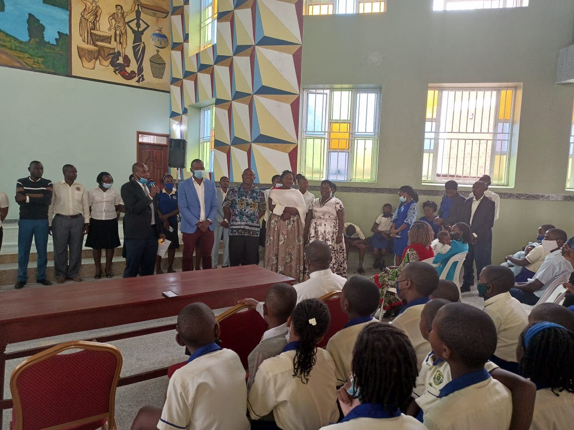 Staff members introduced post Mass