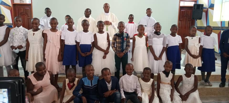 Priests with First Communion children