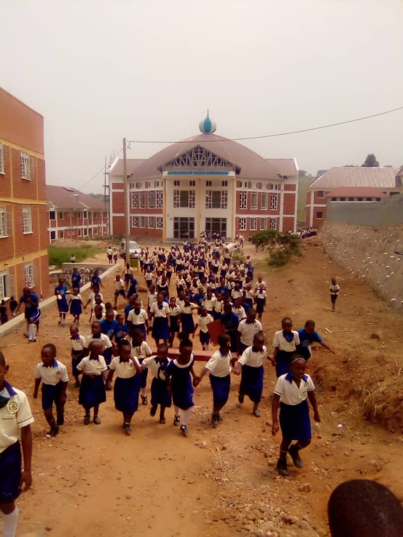 Students leaving auditorium after St. Patricks Day Mass
