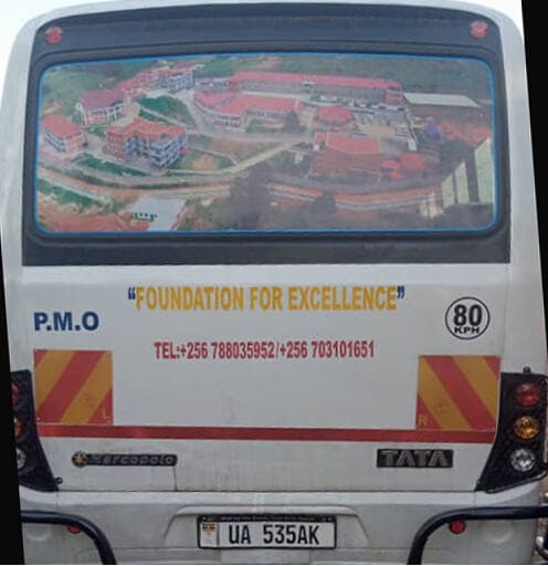 Back of the new bus with photo of BHIK-U campus