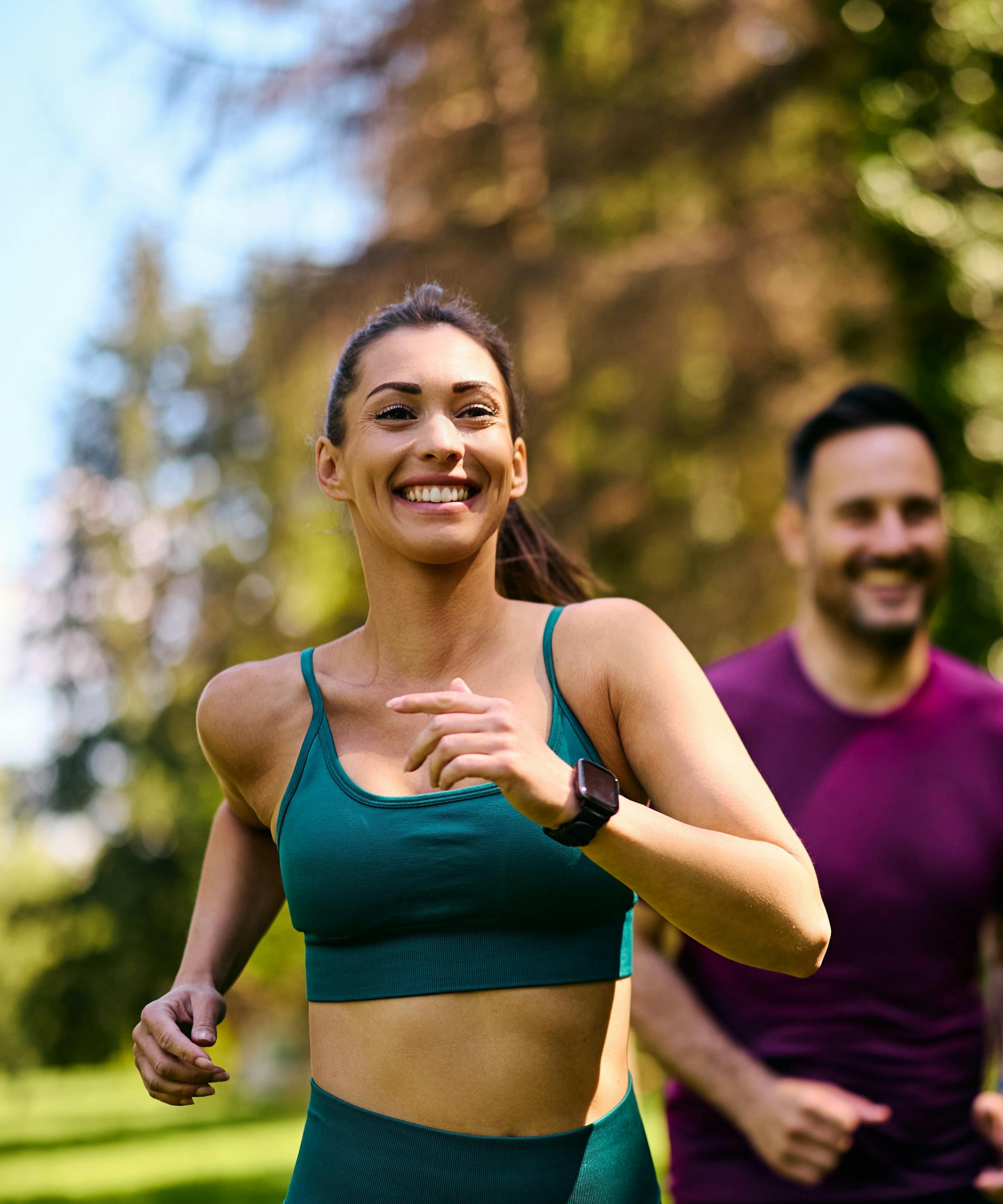 A woman and a man jogging.