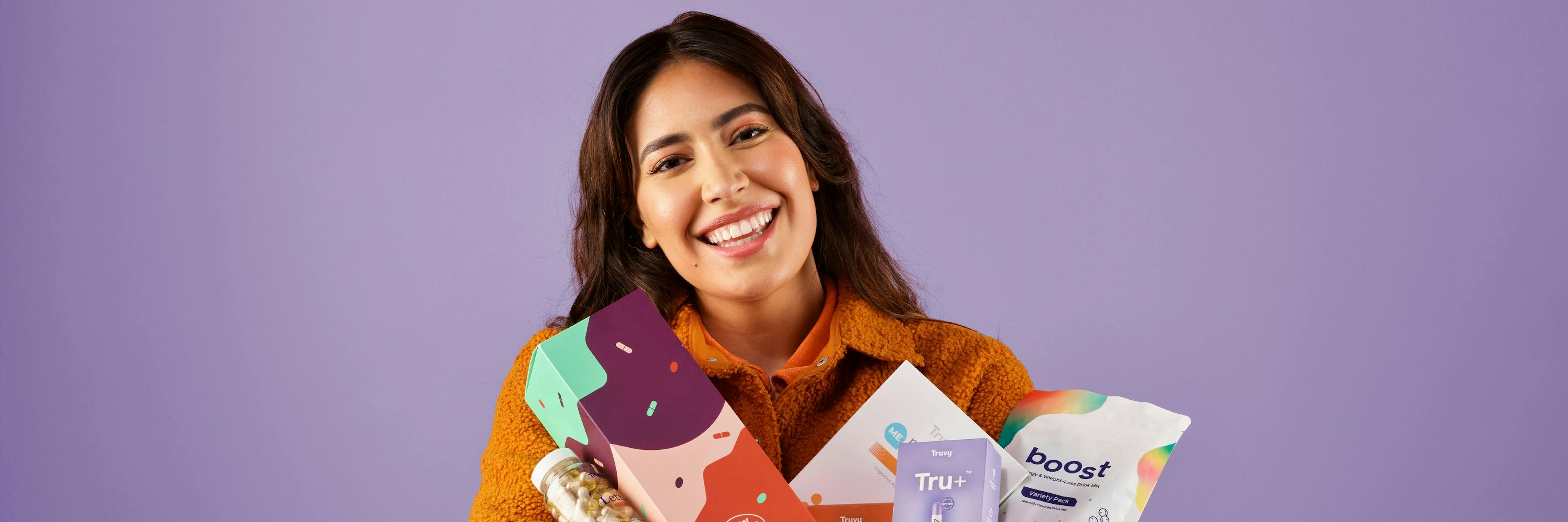 Woman holding Truvy® products