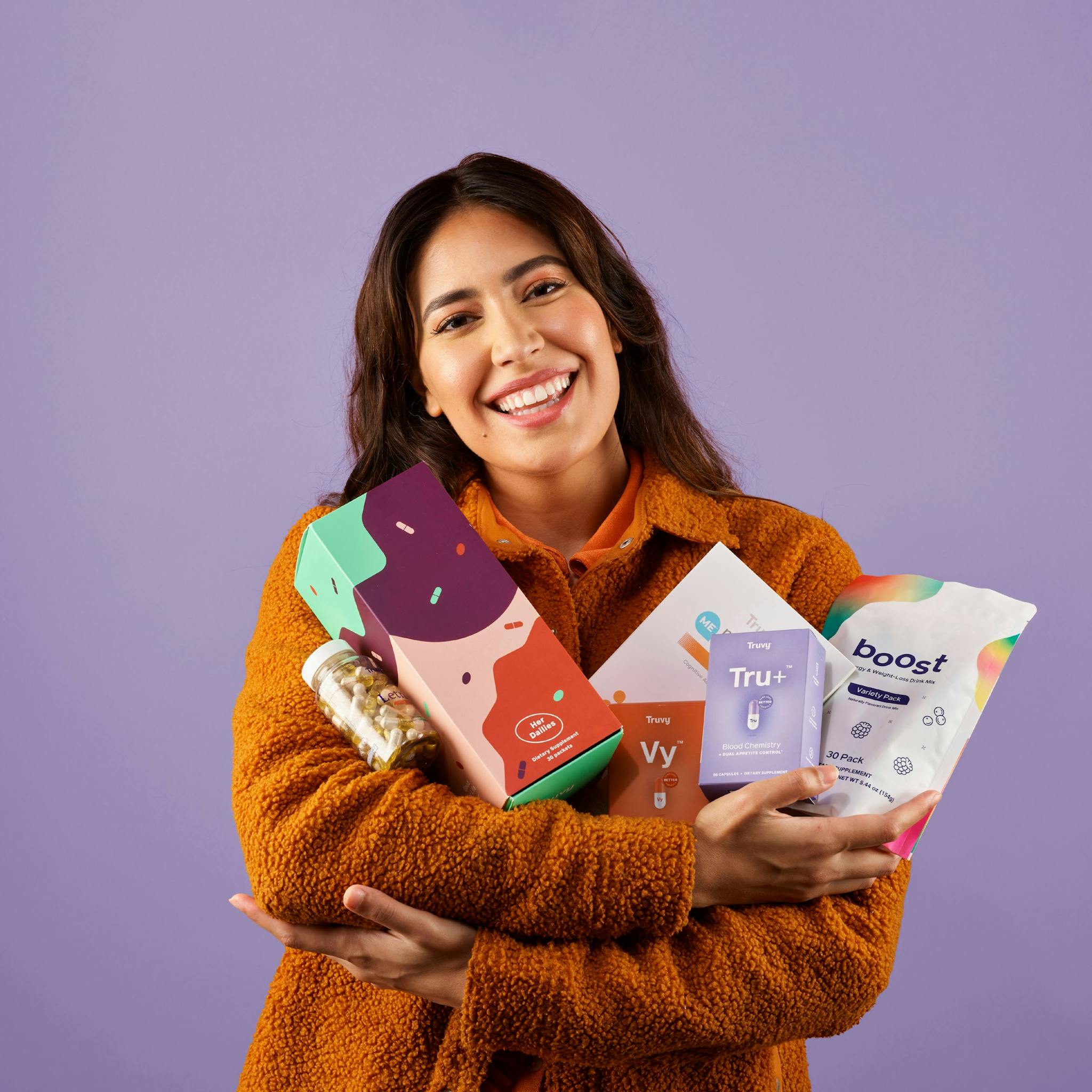 Woman holding Truvy® products