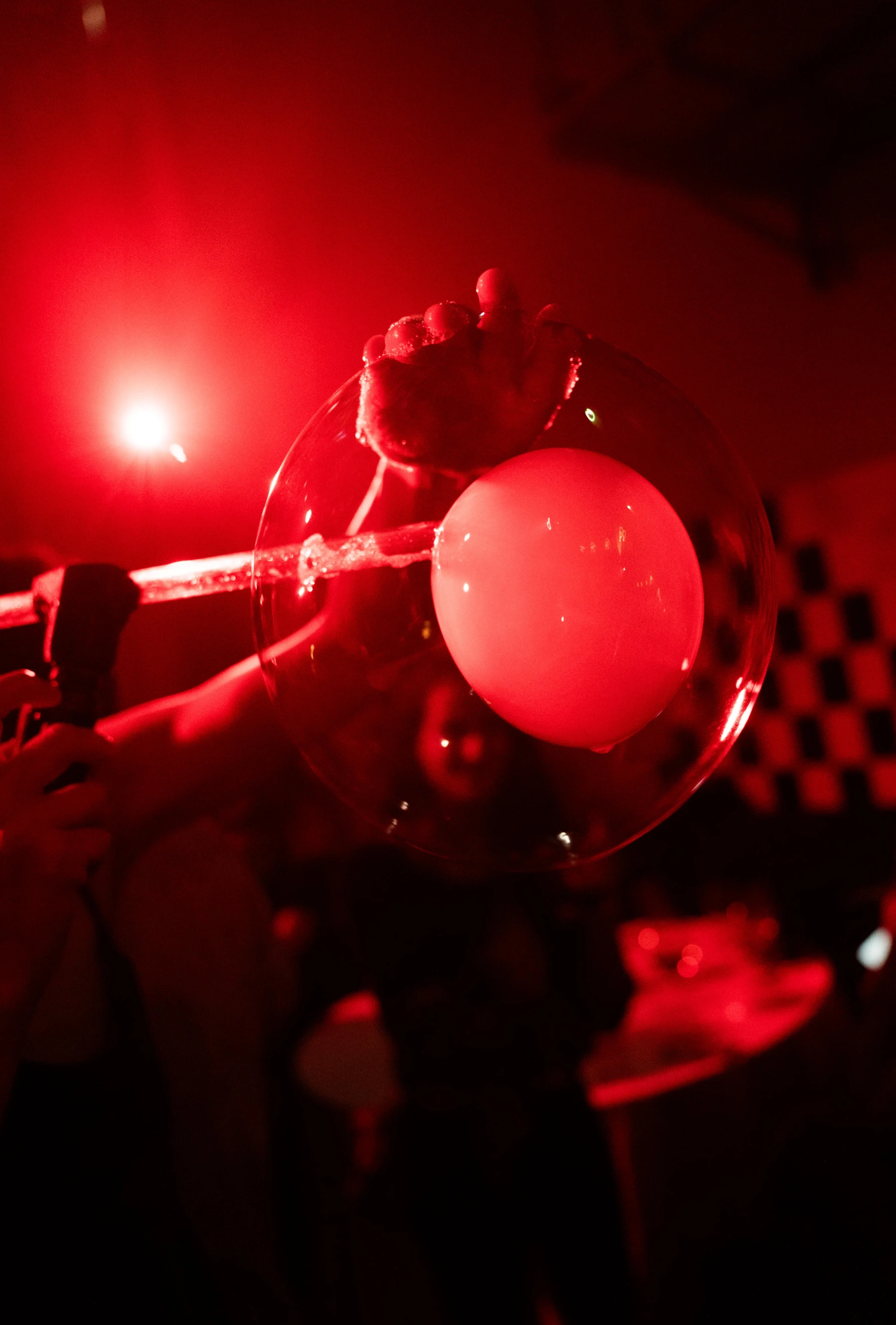 soap balloon under red lights