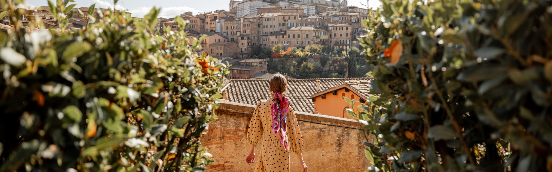 Woman in a yellow dress in Tuscany