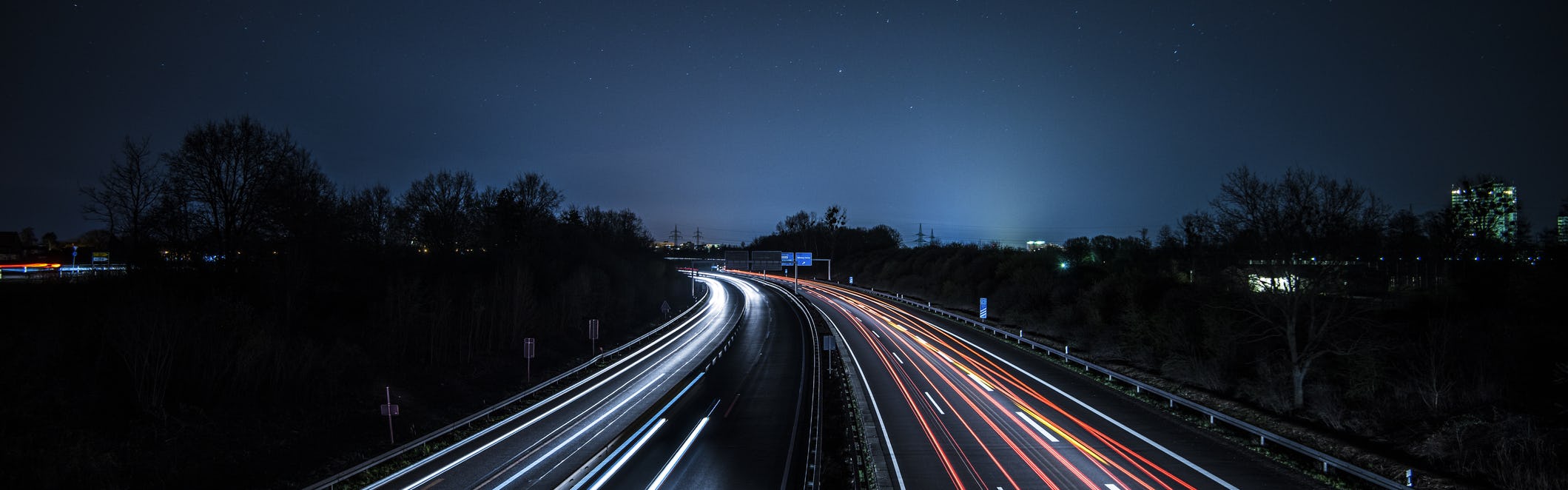 Road at night time with long exposure of vehicle lights