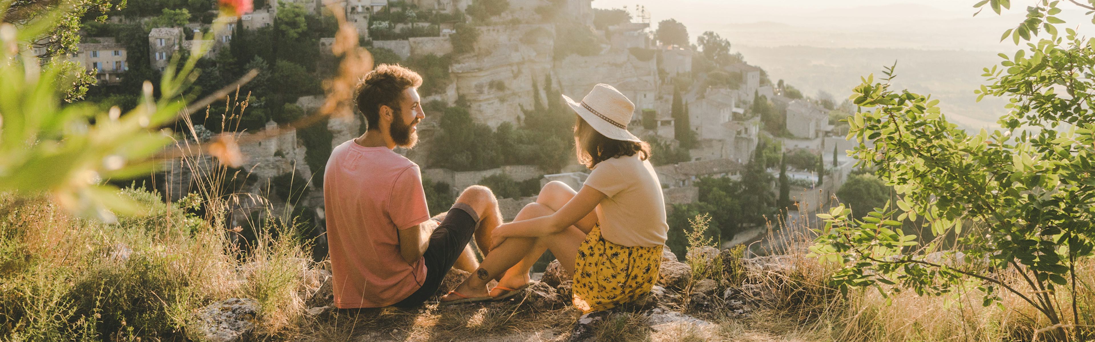 Woman and man looking at scenic view of Gordes village in Provence
