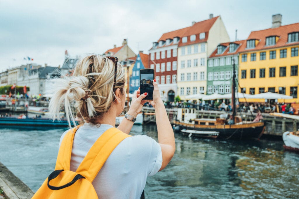 Woman taking a photo while travelling