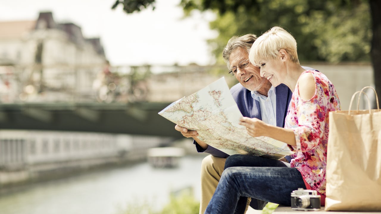 Couple reviewing a travel map on their vacations