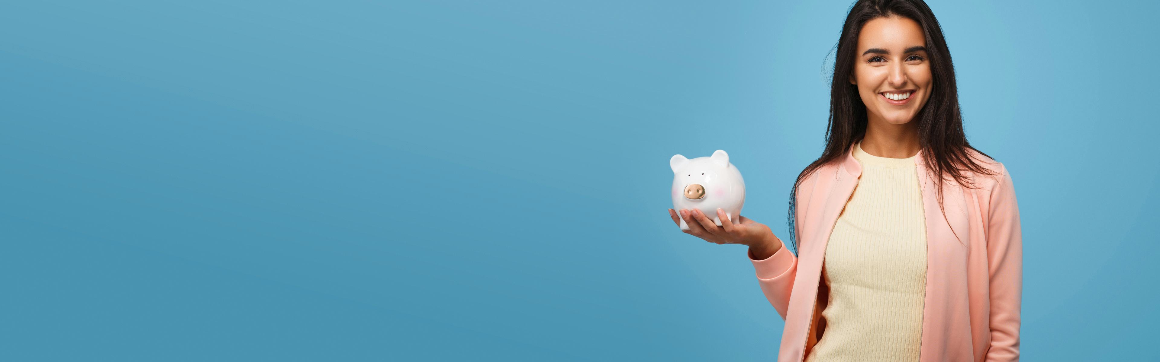 Image of woman holding a piggy bank