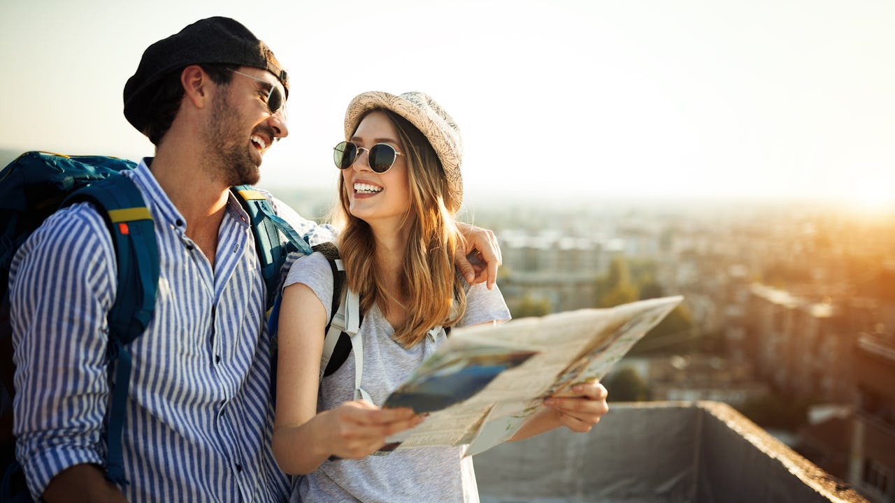 Man and woman browsing a travel map