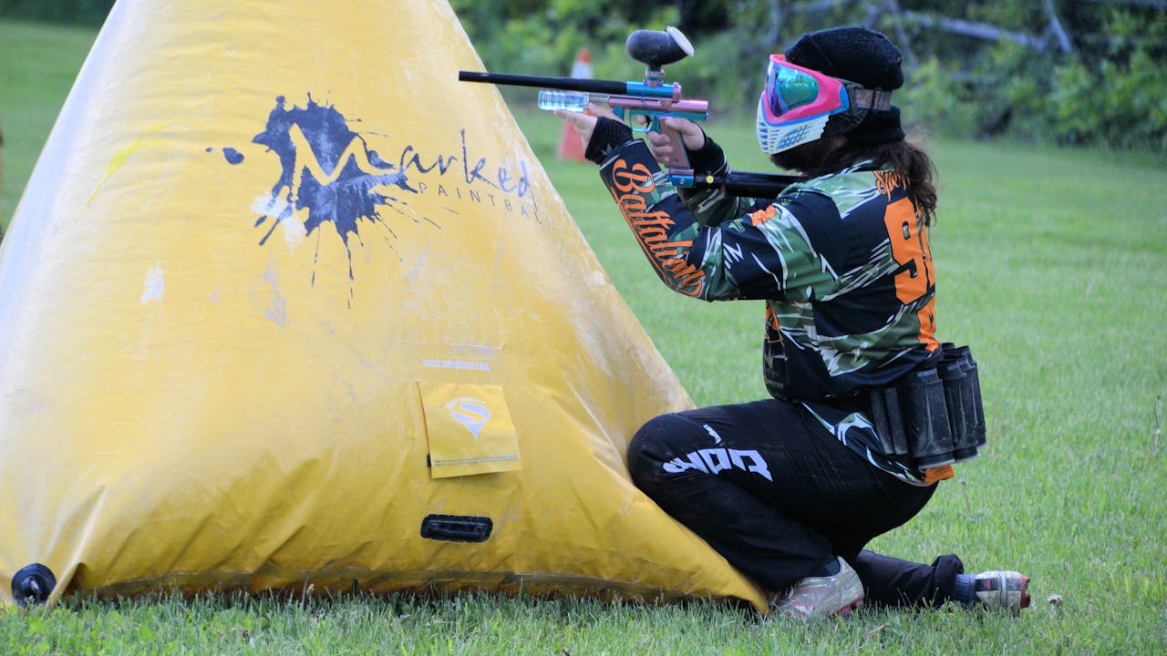 Person playing paintball at MARKED Adventure Park