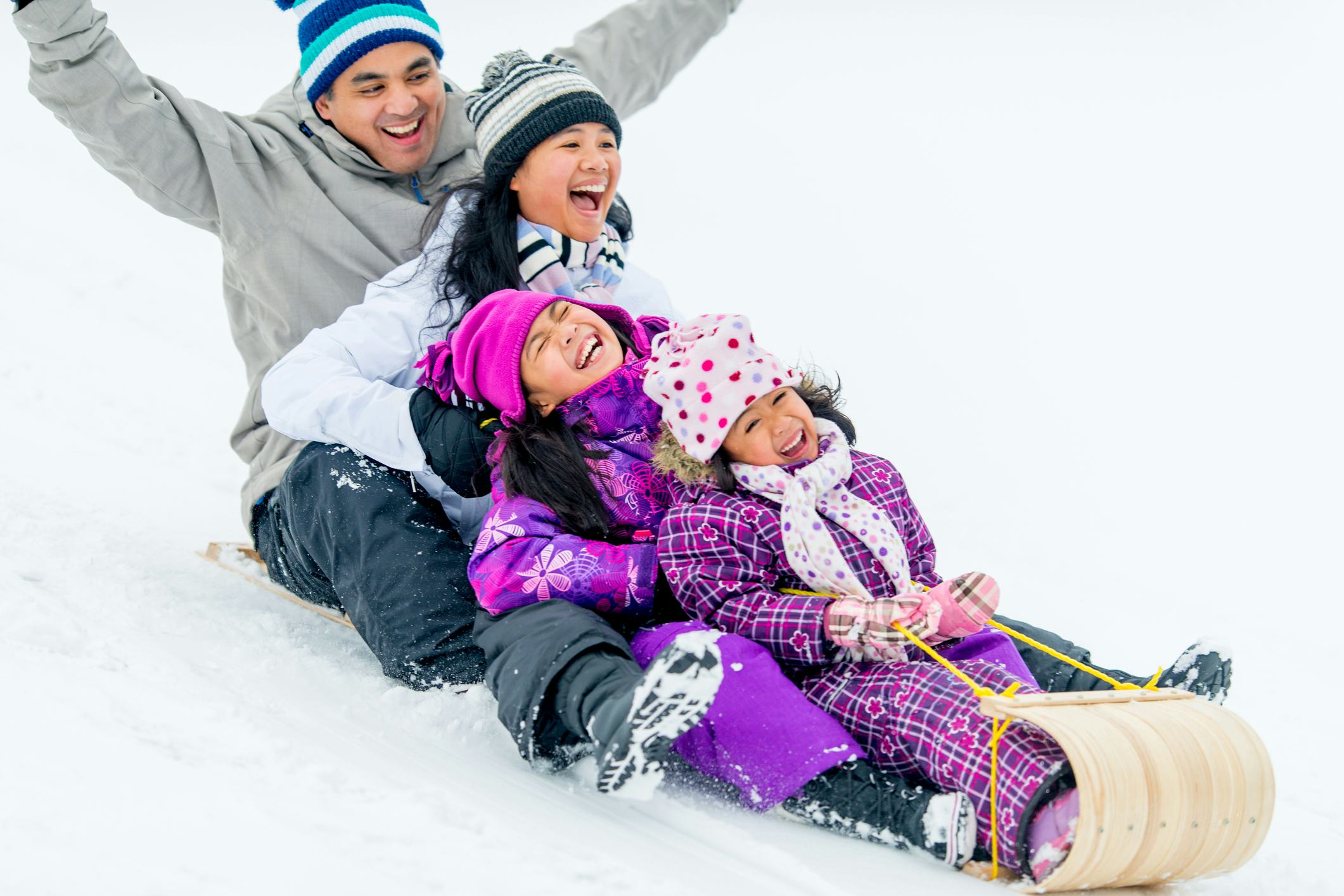 Asian family having fun in winter