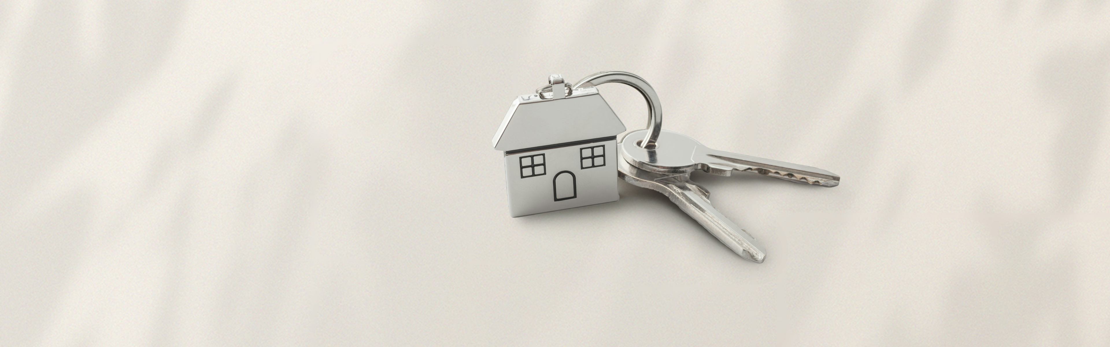 A keychain with a house on it.