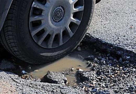 Tire in pothole.