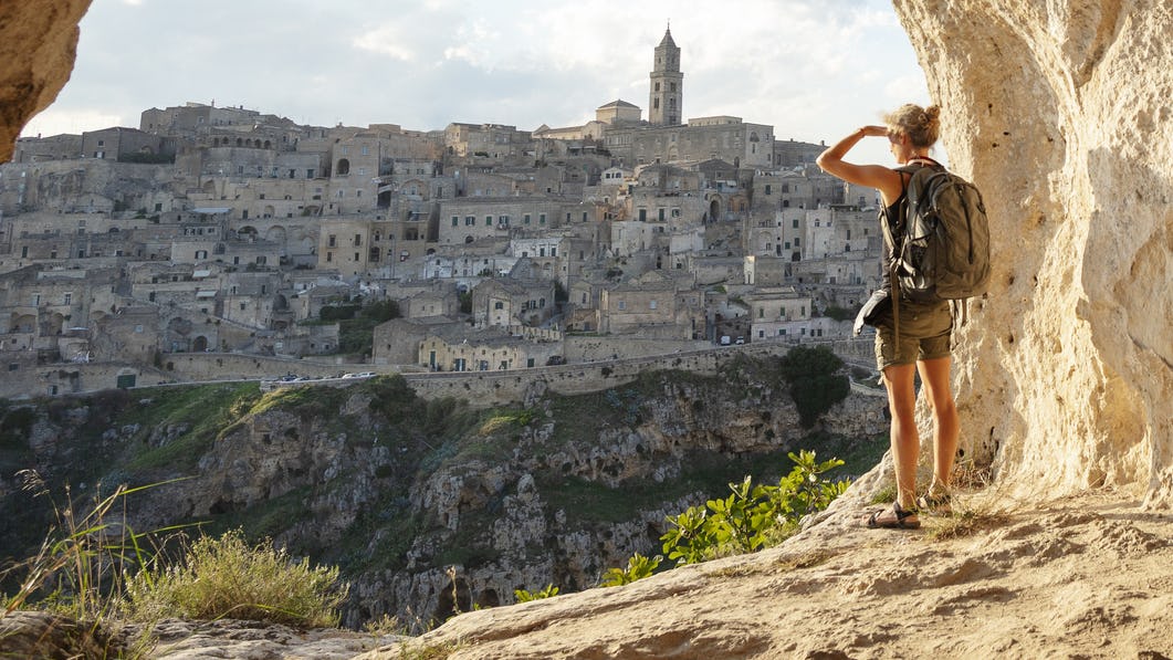 Woman looking at view from a cave of Matera, Basilicata, Italy 