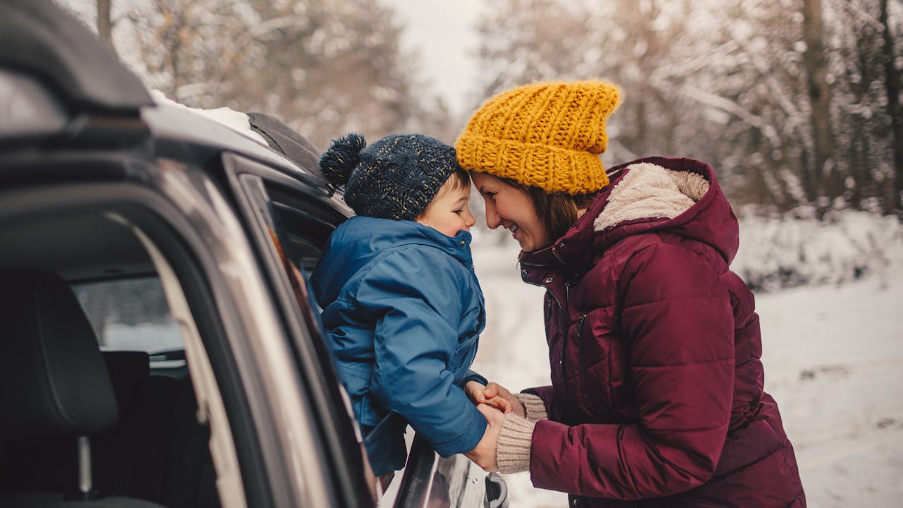 Mother and son in car during winter