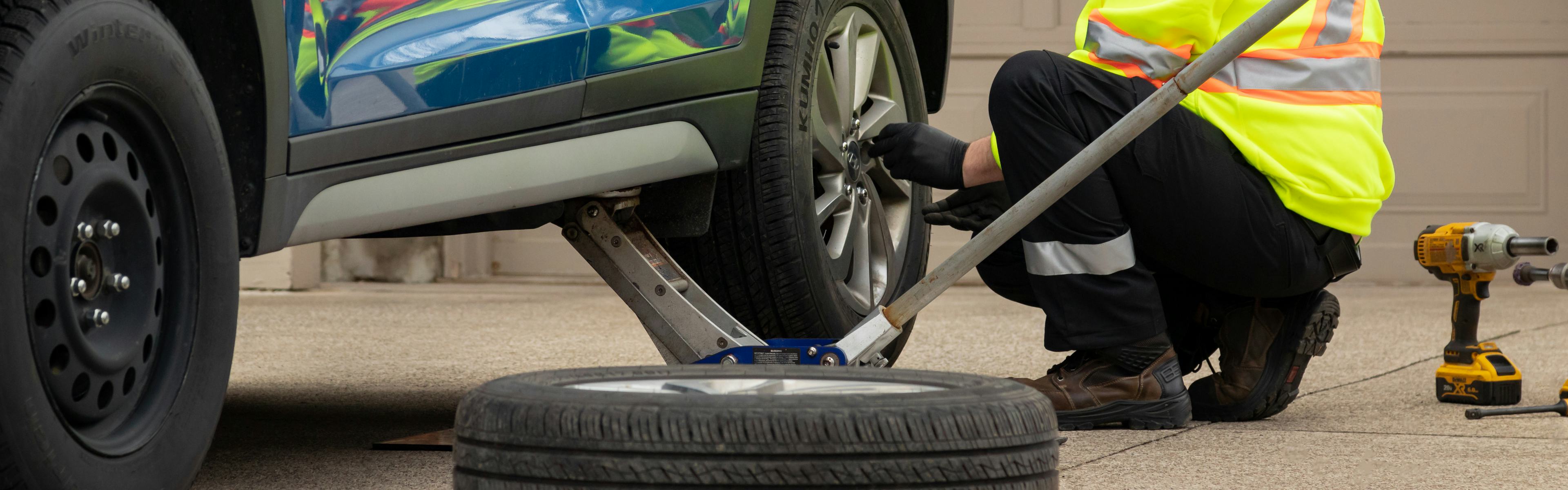 CAA technician changing tires
