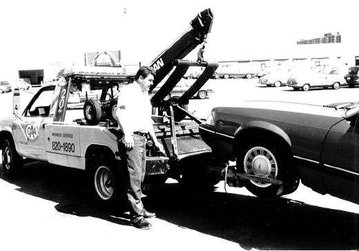 Black and white photograph of old CAA tow truck 