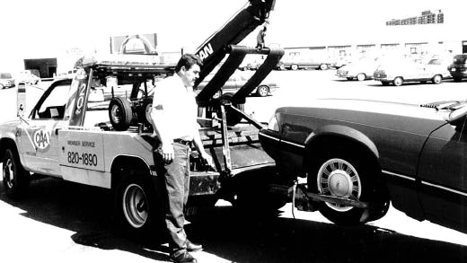 Black and white photograph of old CAA tow truck 
